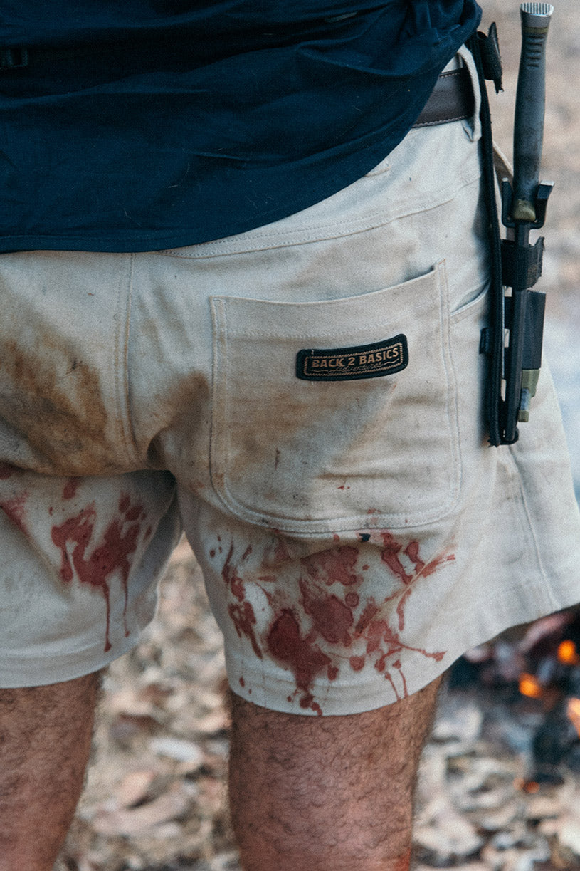 wiping blood on back 2 basics heavy duty cottom shorts while fishing