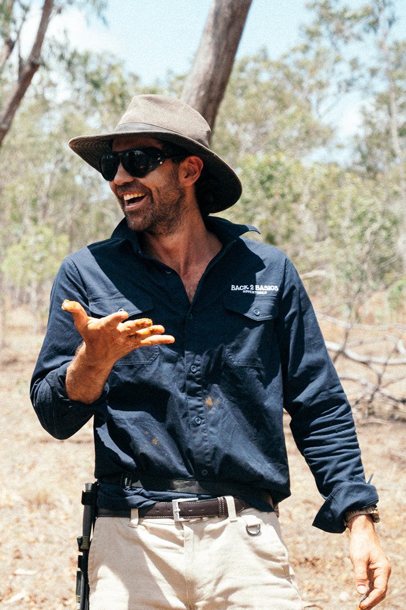 laughing in the australian outback wearing a navy b2b work shirt built for the harsh australian elements