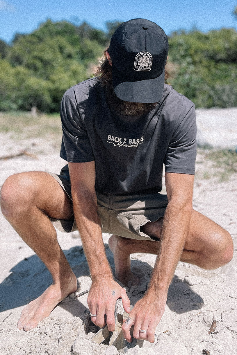 Placing a boat anchor in the B2B Core Tee in classic charcoal