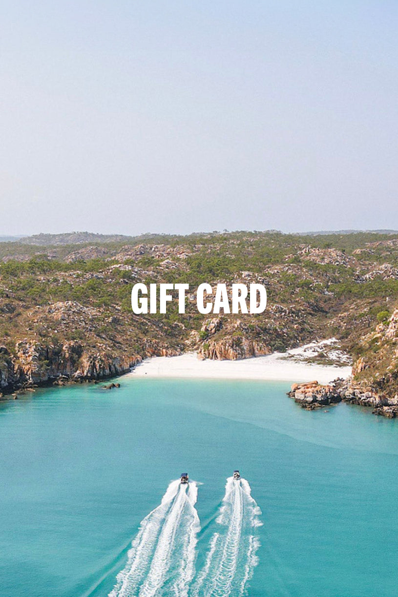 boats landing on a tropical island off australia